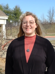 Abby Embry in front of the Compassionate Care Center.
